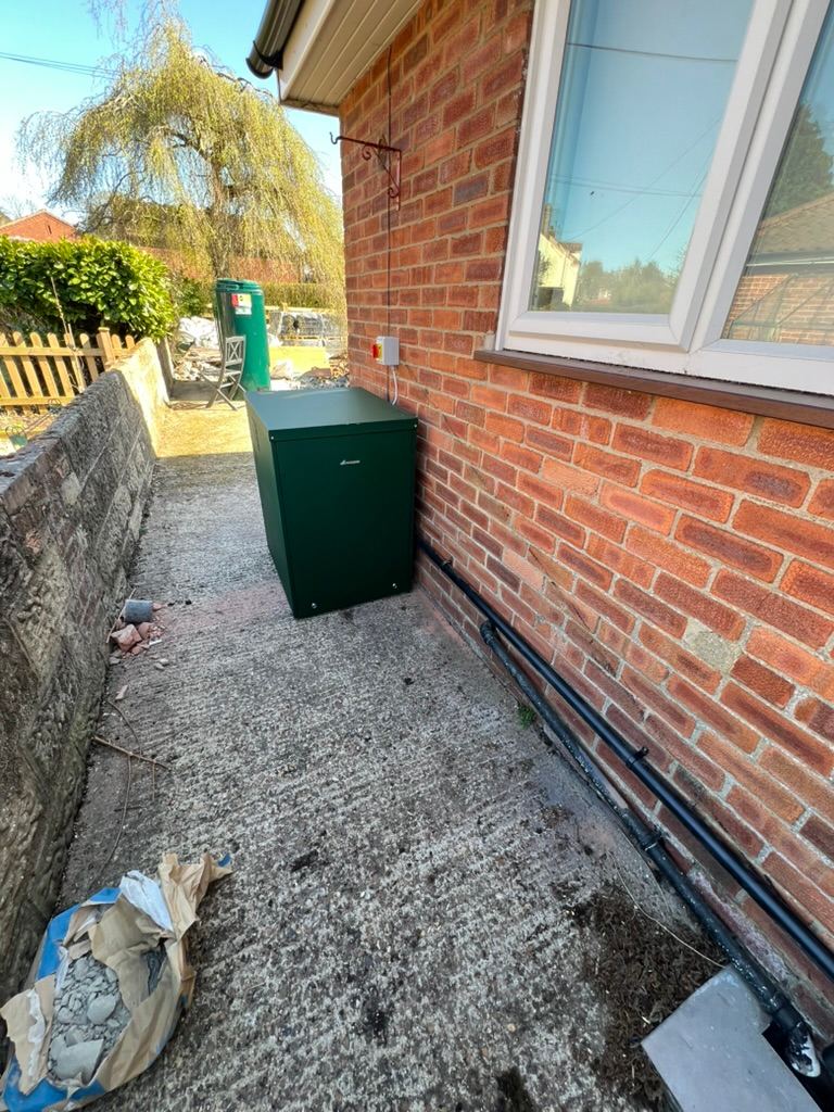 External oil boiler fitted against the wall of a Norfolk bungalow