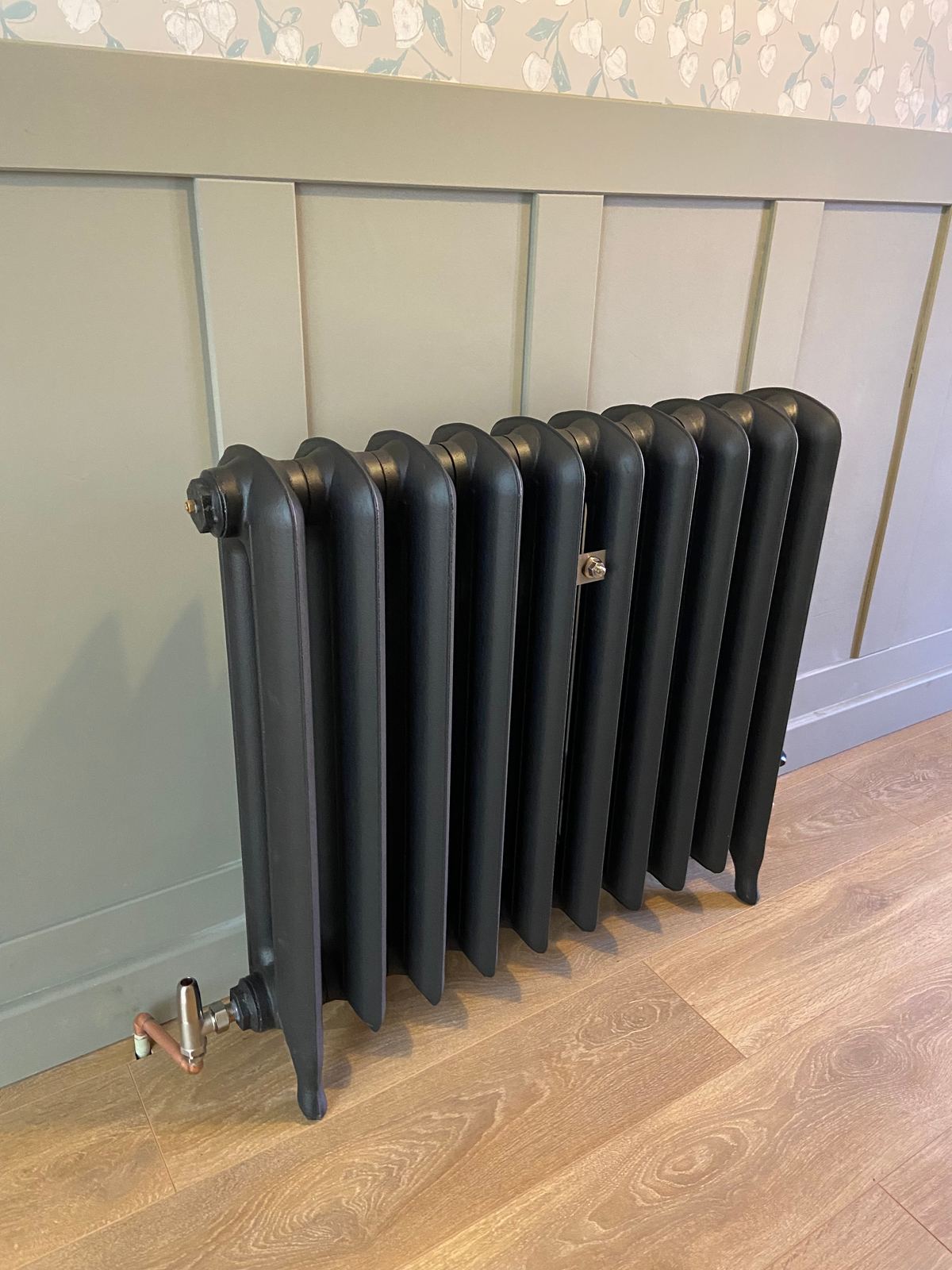 Black cast iron column radiator fitted on a new circuit