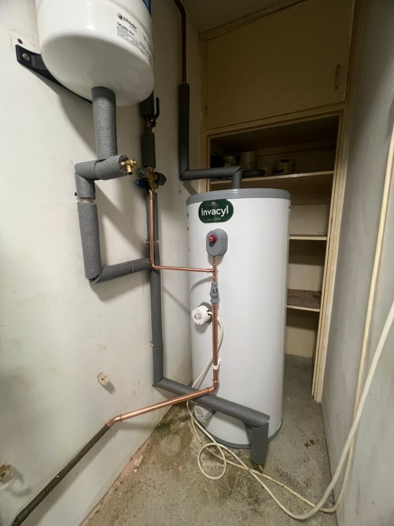 Unvented hot water cylinder with its expansion vessel and pipework